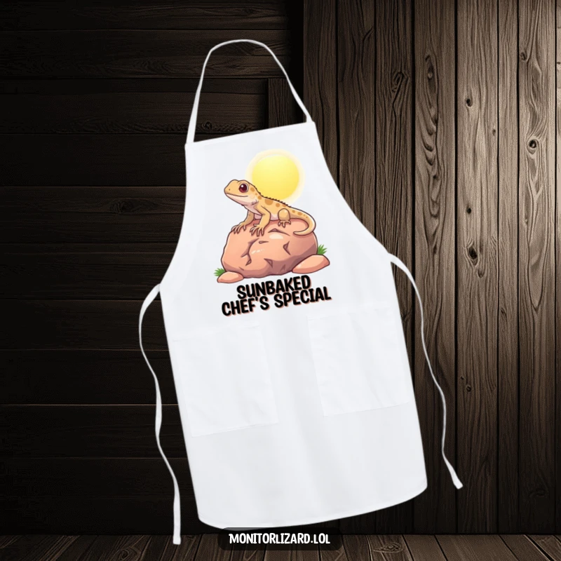 Funny apron with a content monitor lizard basking on a rock, adding a humorous touch to kitchen duties.