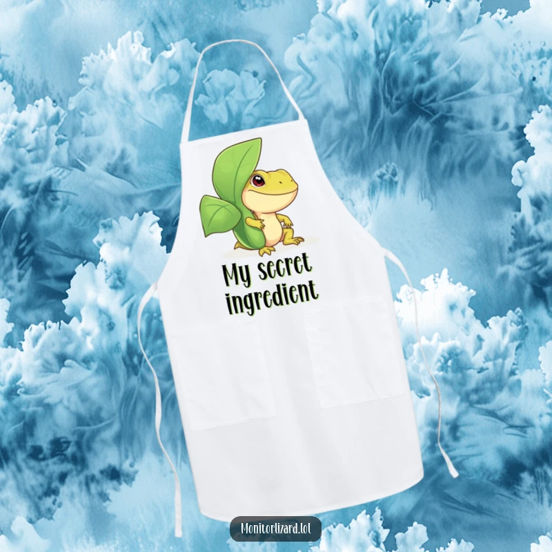 Funny monitor lizard apron featuring a smiling reptile peeking from behind a leafy plant, ideal for chefs and home cooks who love humor.