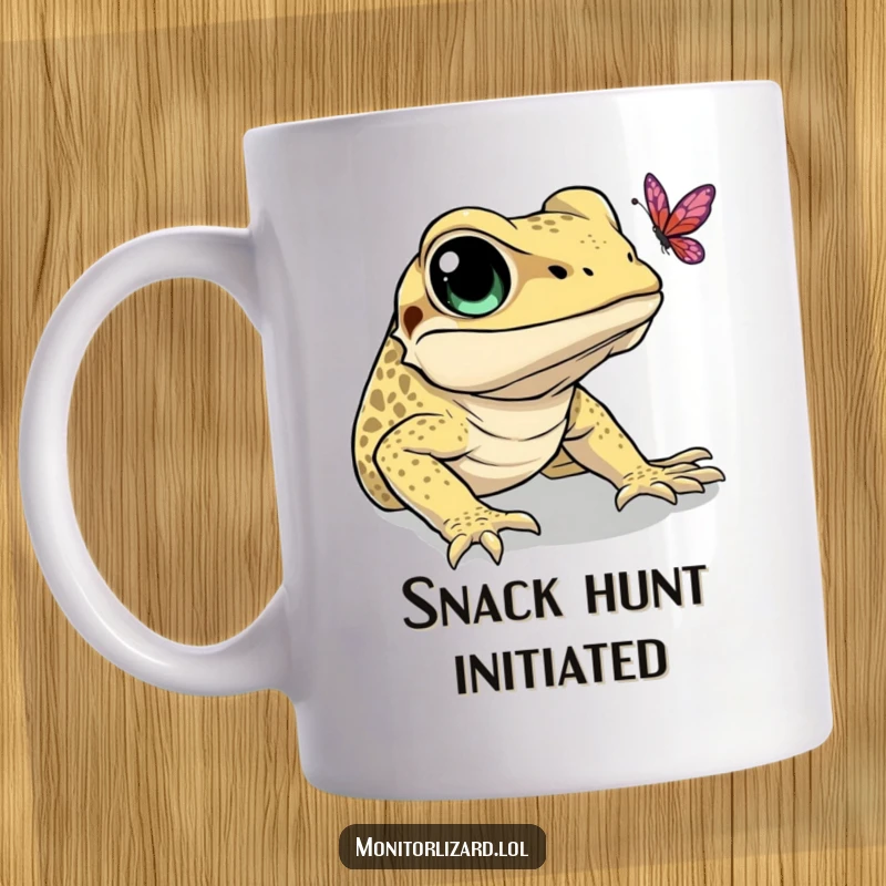 Funny mug showing a monitor lizard with wide eyes, hilariously trying to catch a delicate butterfly in mid-air.