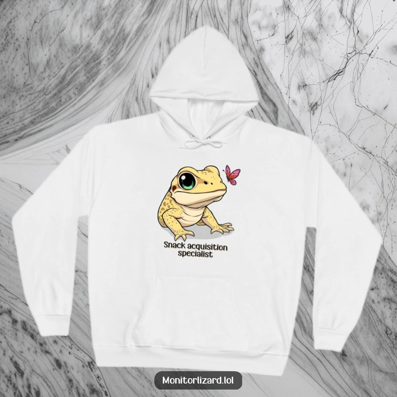 Funny hoodie featuring a monitor lizard with wide eyes, in a humorous attempt to catch a butterfly. Cozy adventure wear.