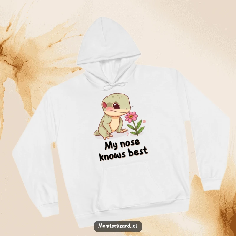 Funny monitor lizard hoodie with a curious reptile sniffing a tiny, colorful flower, ideal for staying warm and showcasing a love for nature.