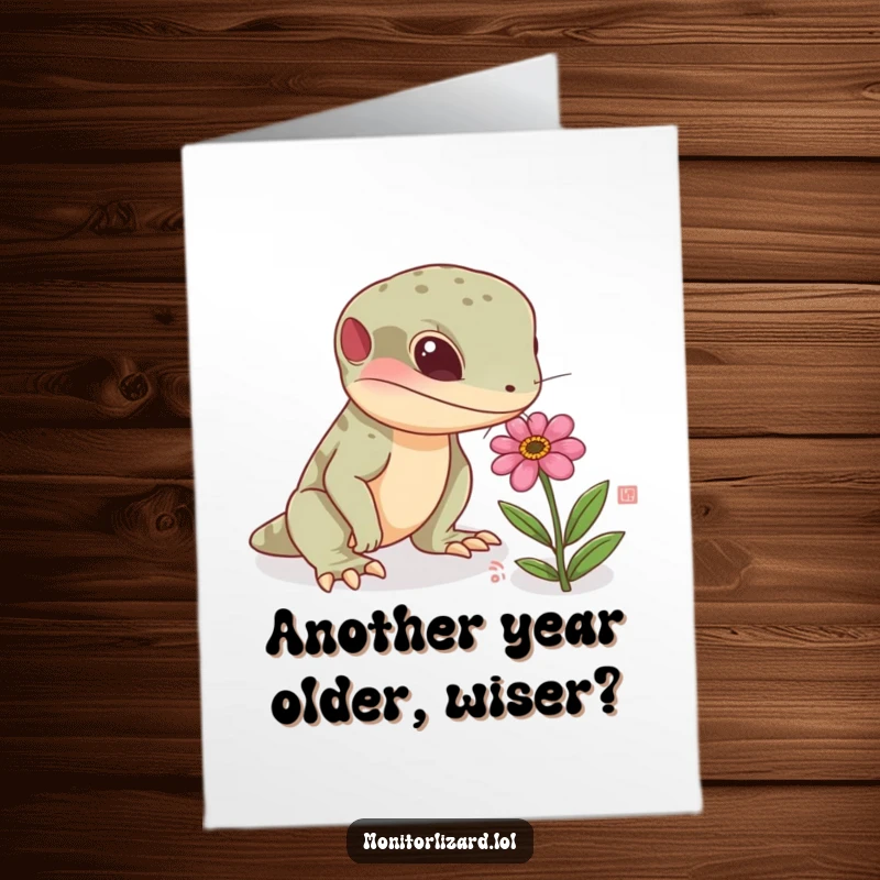 Free Printable Birthday Card featuring a curious monitor lizard character sniffing a tiny, colorful flower with interest.