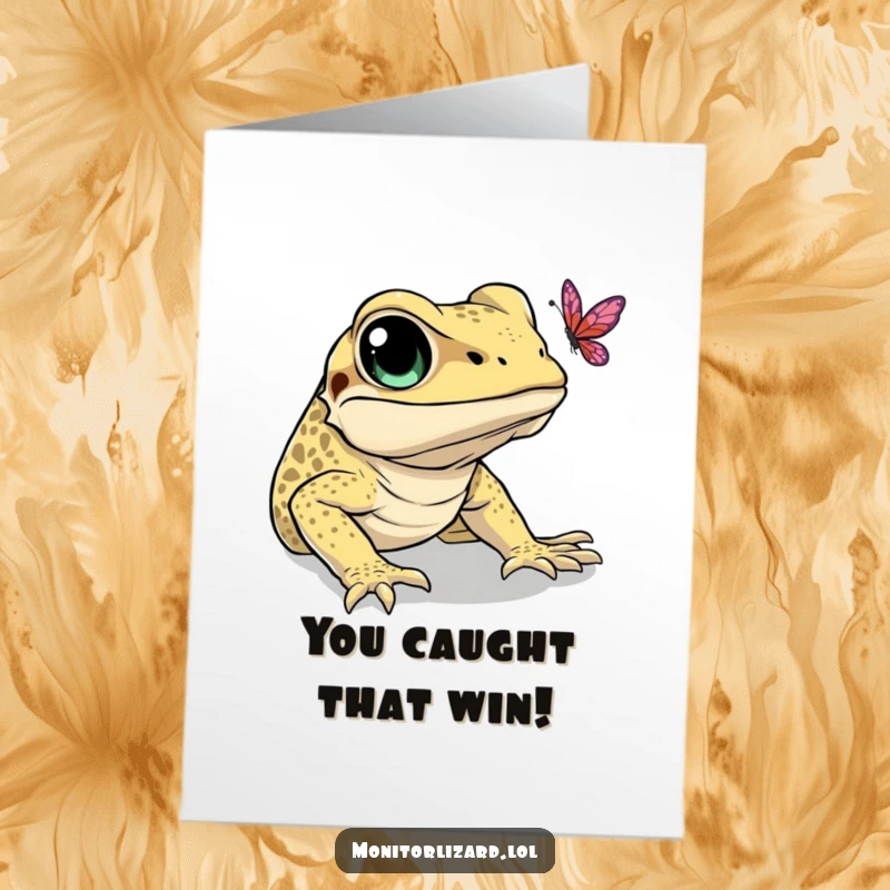 Funny Free Printable Congratulations Card showing a monitor lizard with wide eyes intently trying to catch a floating butterfly.