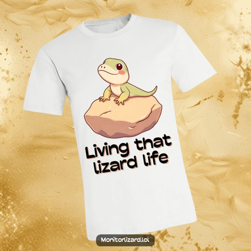 Funny Monitor Lizard T-Shirt: A cute monitor lizard character is humorously depicted happily sunbathing on a warm, smooth rock.