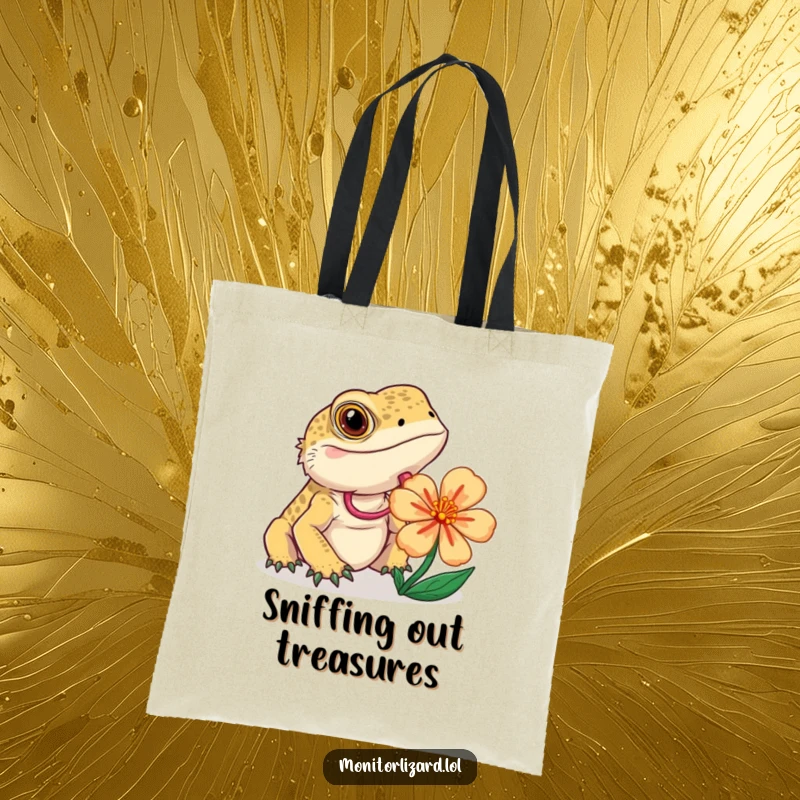 Funny monitor lizard tote bag showing a curious lizard flicking its tongue while examining a colorful flower, practical and unique.
