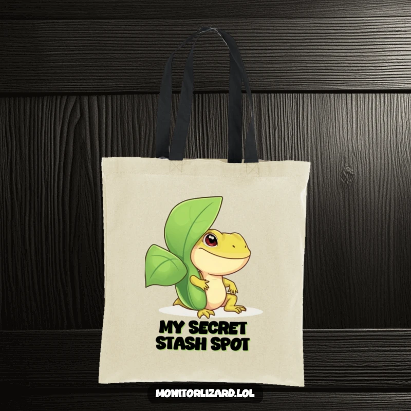 Funny monitor lizard tote bag with a smiling reptile peeking from behind a large, green leafy plant, great for shopping and daily use.